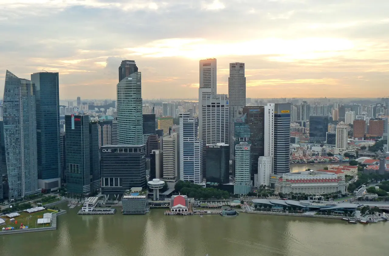 The breathtaking Marina Bay Sands SkyPark—a quintessential in Singapore must-visit experience—showcasing the infinity pool, dramatic skyline views, and seamless integration of design and function. Marina Bay Sands SkyPark overlooking Singapore skyline with infinity pool and lush greenery