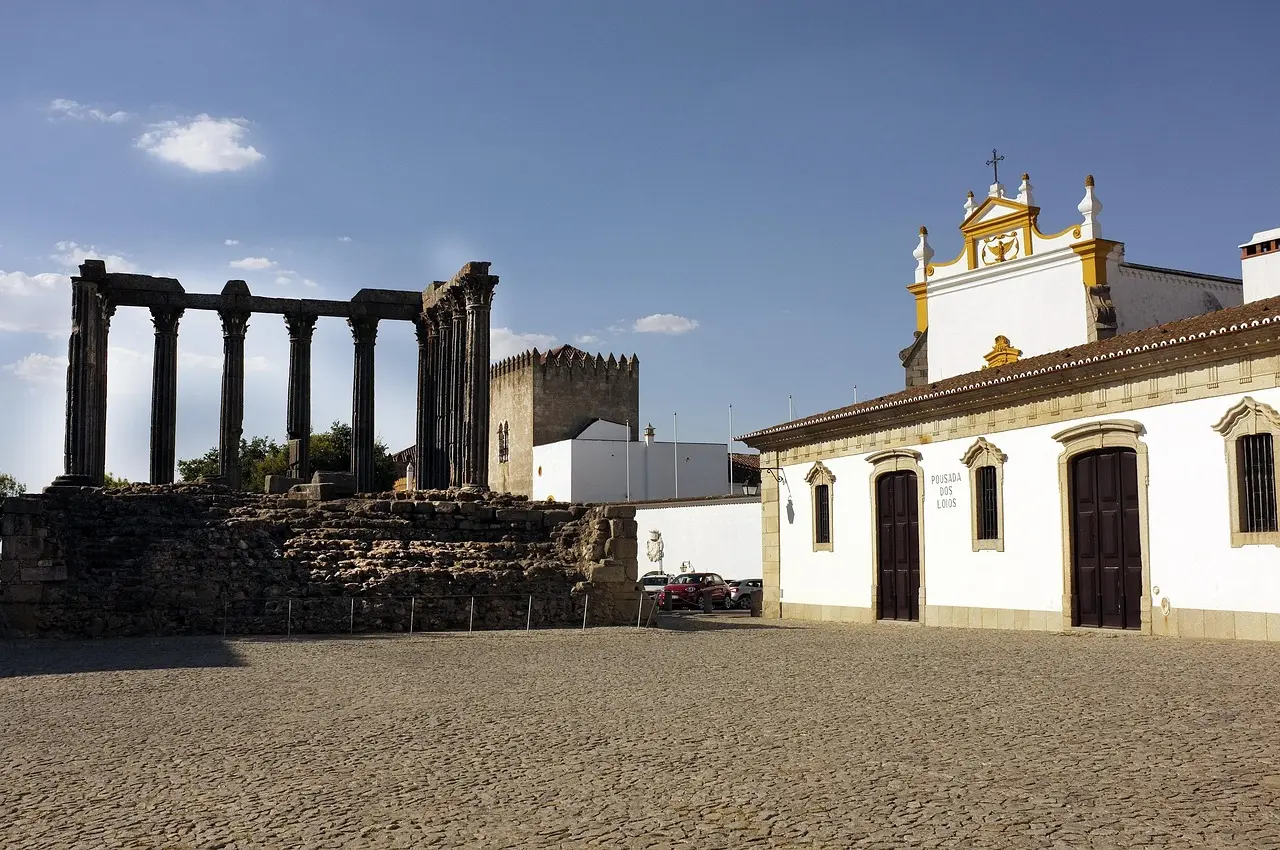 Well-preserved 1st-century Roman Temple of Diana standing proudly in Évora’s historic center beside medieval and Renaissance architecture Roman Temple of Diana in Évora with surrounding cobblestone plaza and historic buildings