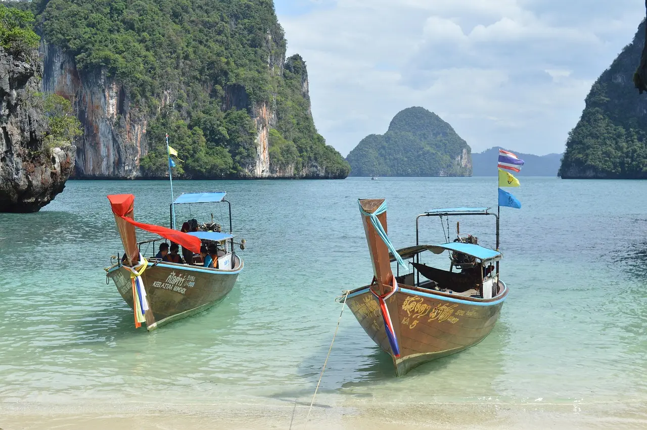 Overcrowded longtail boat at Phi Phi Islands with many tourists