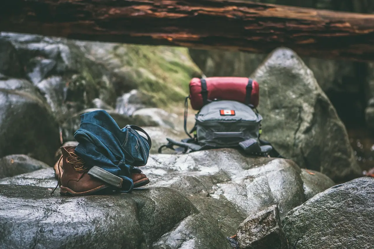 Essential gear for diving, skiing, and rock climbing laid out together — a practical visual guide for travelers planning multi-sport adventure and outdoor destinations trips Organized gear setup for three sports: scuba tank and mask, ski boots and poles, climbing shoes and chalk bag on wooden table