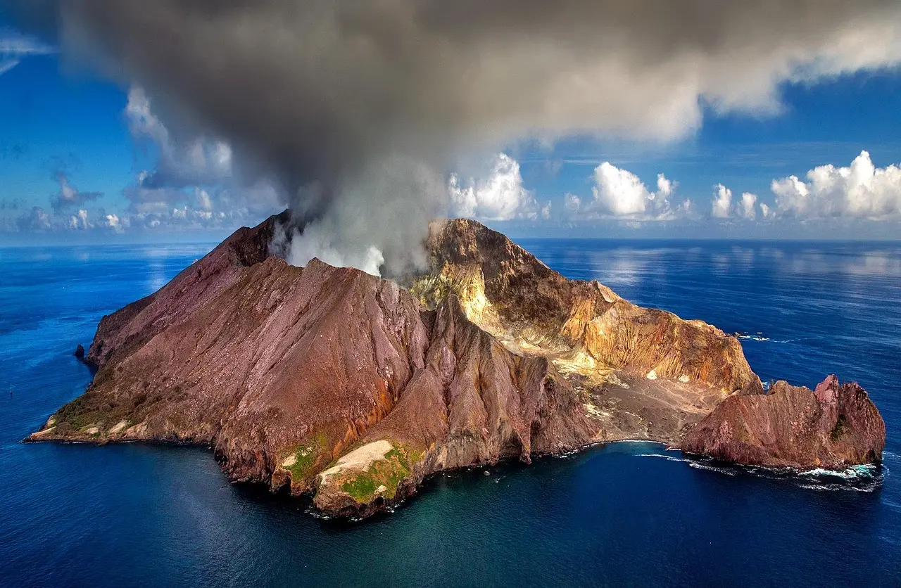 Geographic diversity in miniature — how Komodo’s islands offer layered, evolving ways to appreciate natural scenery Aerial view of Padar Island in Komodo National Park showing three distinct bays with varying shades of blue water and rugged volcanic terrain