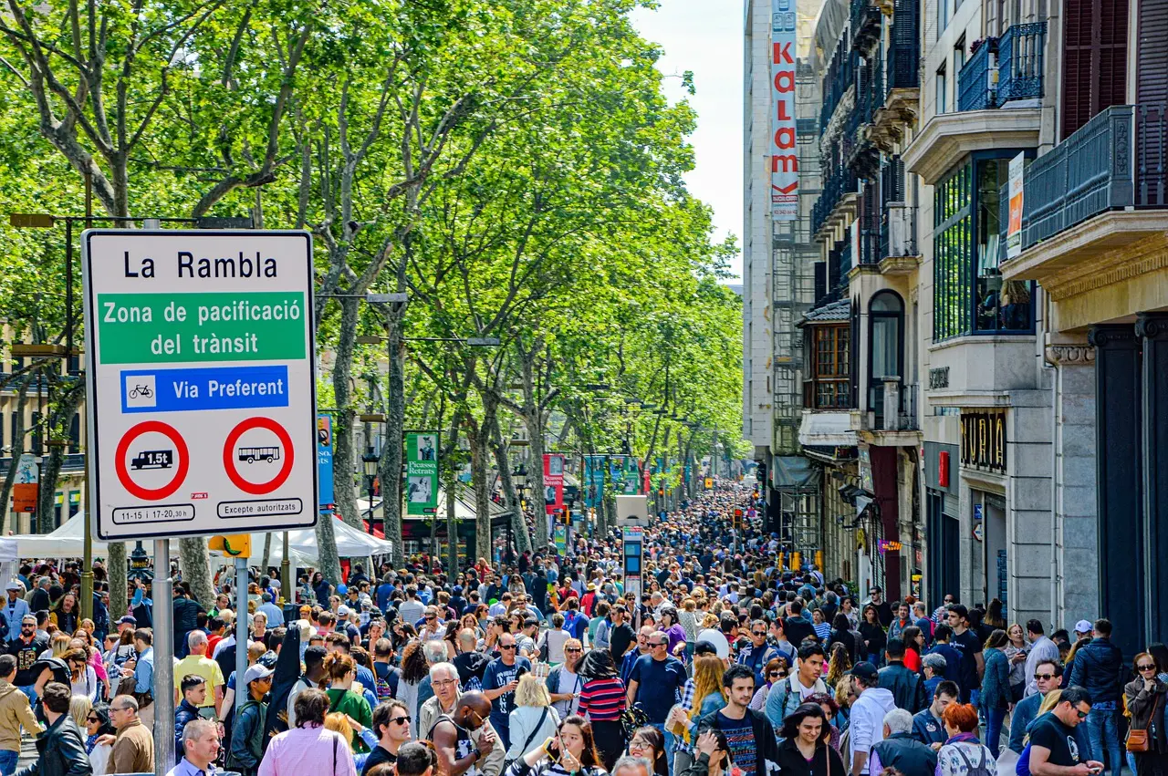 Authentic Barcelona retail corridor highlighting local craftsmanship and accessible VAT refund opportunities for shopping consumption Barcelona shopping street with colorful ceramic tiles, boutique windows, and outdoor café seating