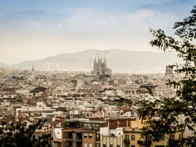 Aerial view of Barcelona showing Sagrada Familia, beaches, and Gothic Quarter rooftops