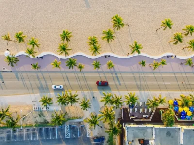 Aerial view of Thailand's coastline with white sand beaches and palm trees