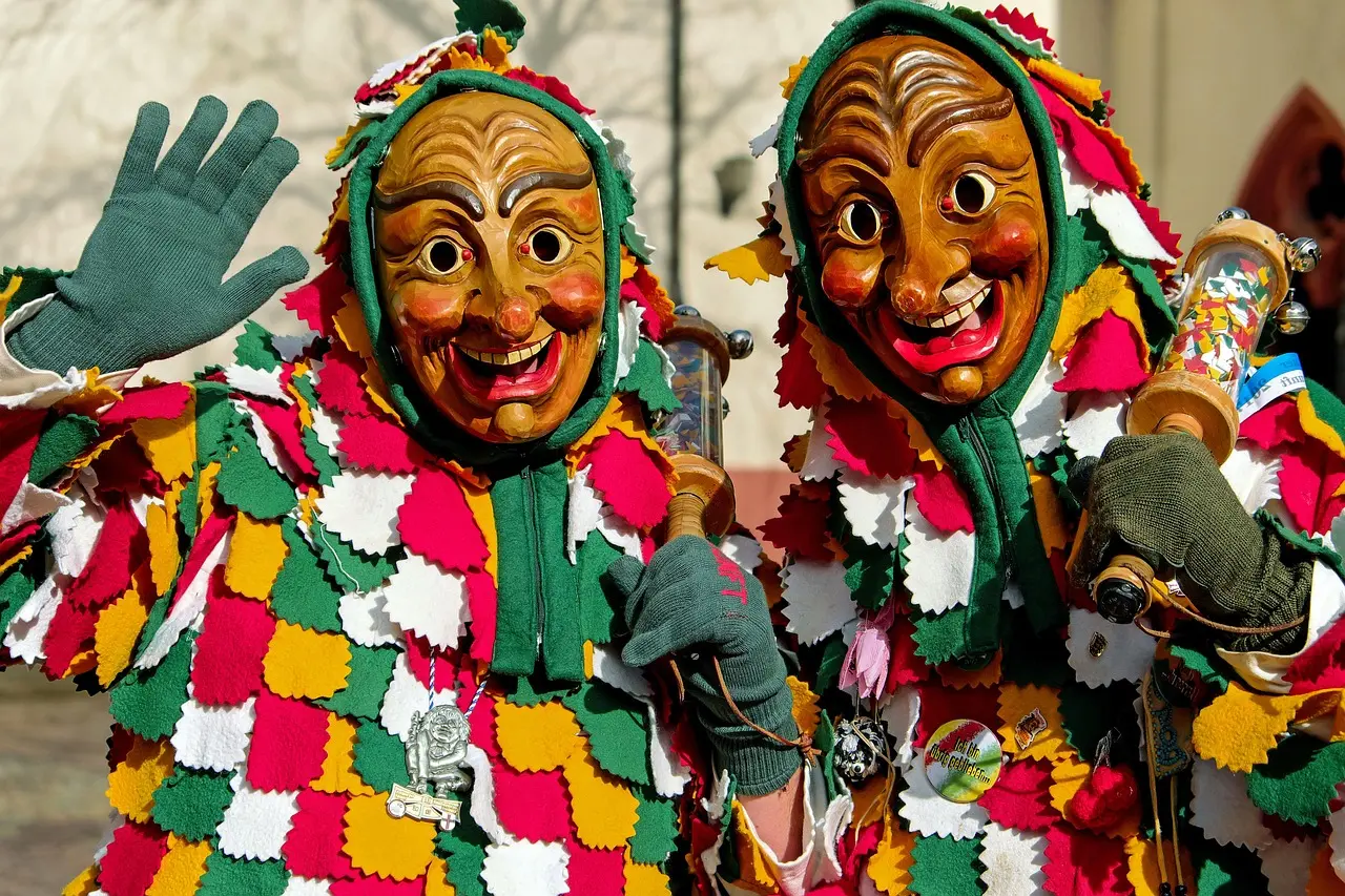 Mamuthones procession in Mamoiada, Sardinia — an ancient, visceral cultural experience through local festivals and folk performances Mamuthones performers in sheepskin robes and wooden masks walking through snowy Sardinian village street