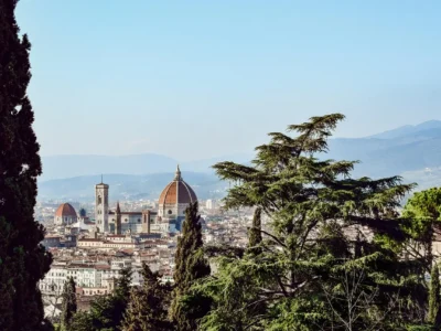 Aerial view of historic Florence with red rooftops and the Duomo dominating the skyline