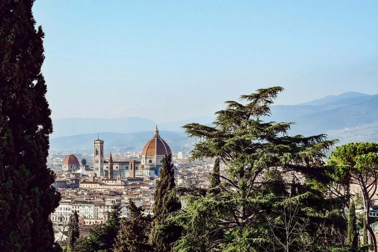 Aerial view of historic Florence with red rooftops and the Duomo dominating the skyline