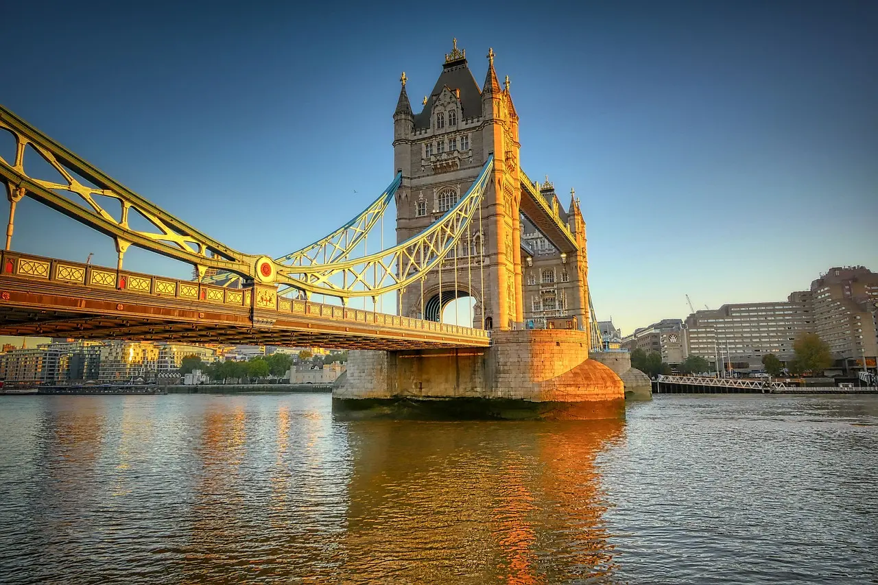 Passenger boat cruising past Tower Bridge on the River Thames