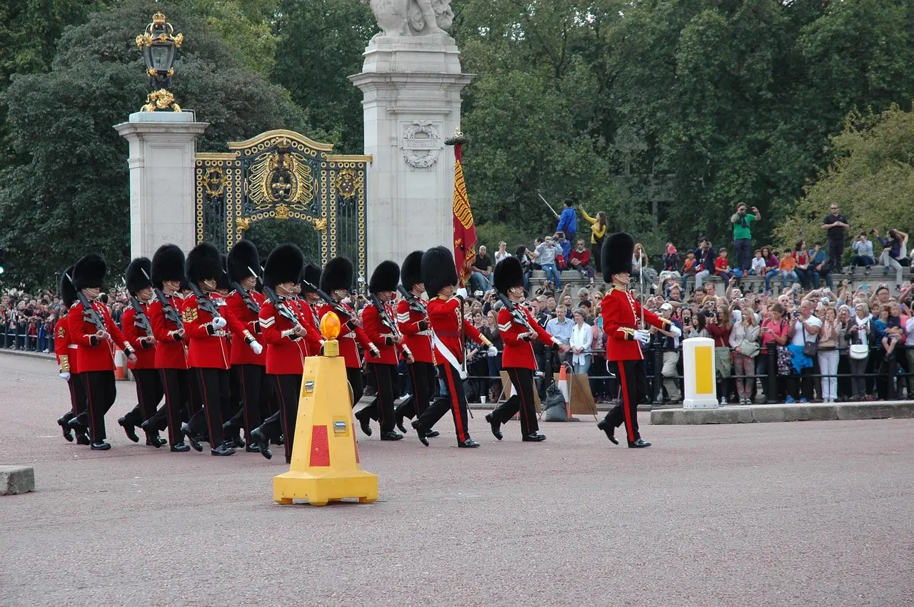 Changing of the Guard ceremony outside Buckingham Palace with crowd watching