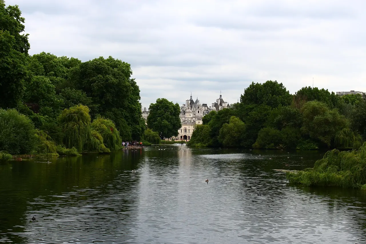 Rowboats on the Serpentine Lake in Hyde Park with city skyline in distance