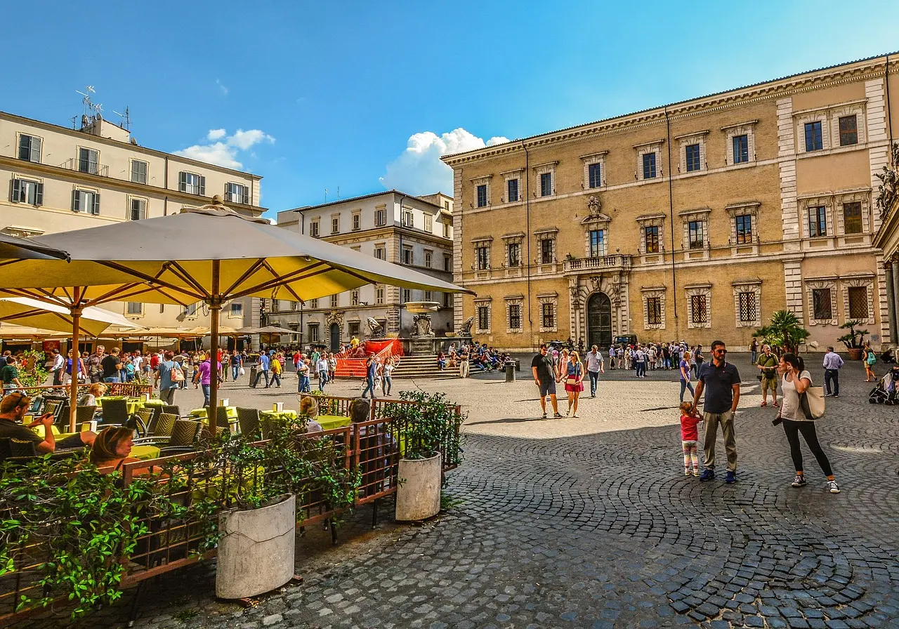 Evening scene in Trastevere with string lights, ivy-covered buildings, and outdoor dining