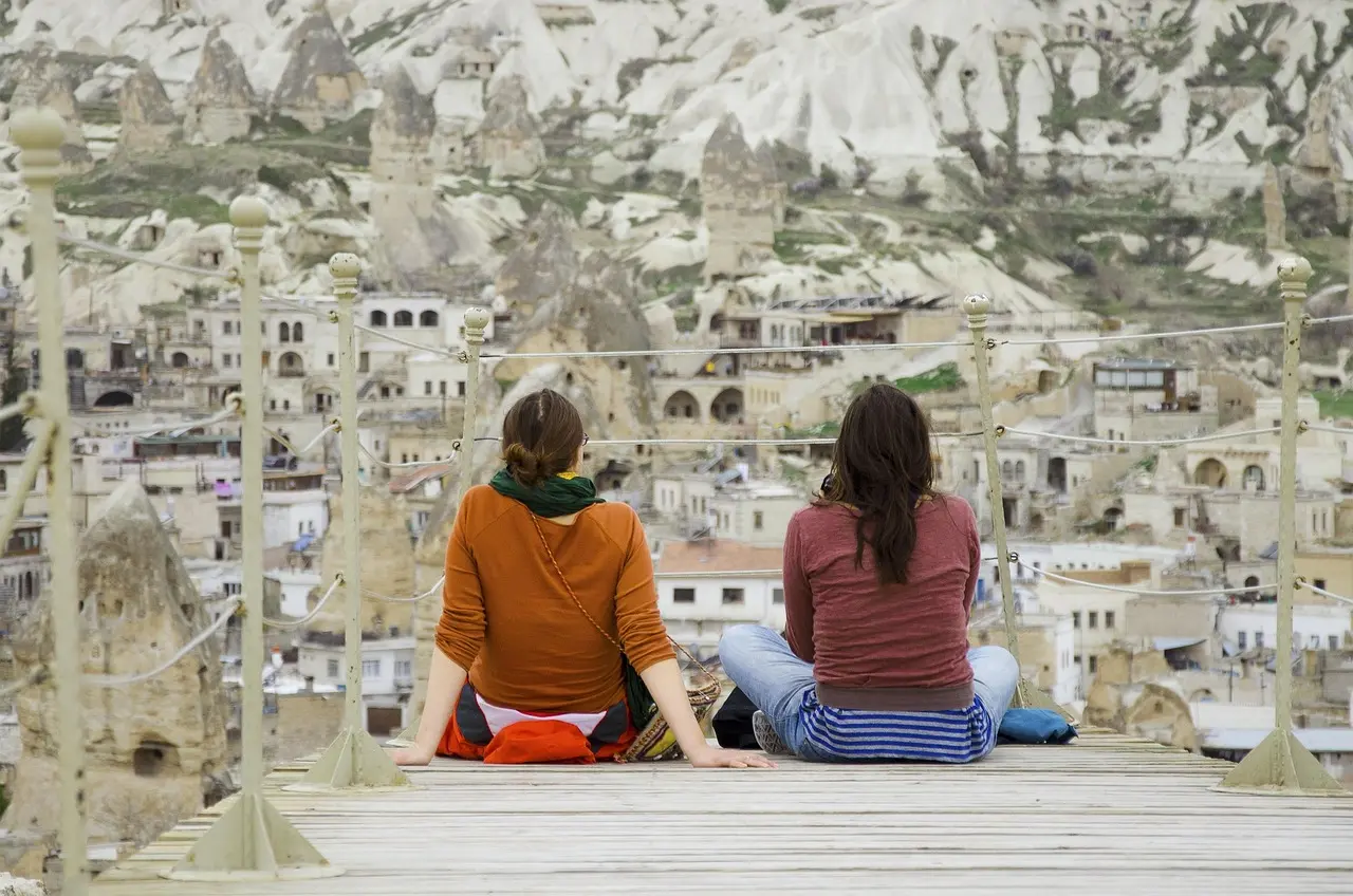 Traditional cave houses in Göreme village under starry night sky