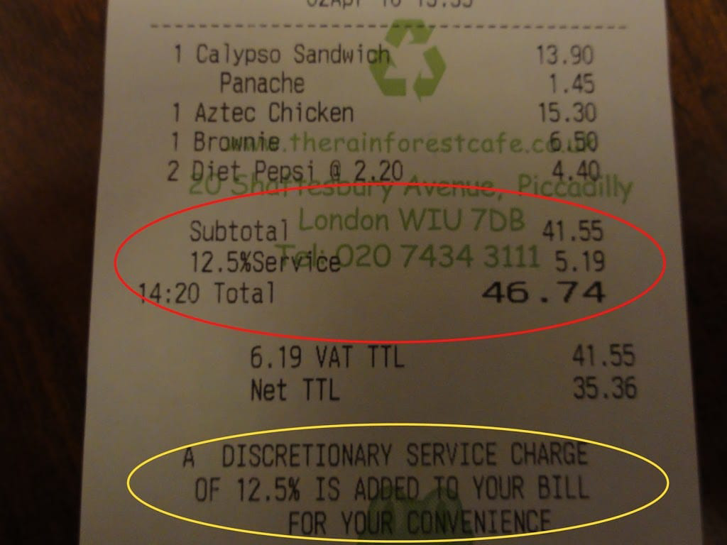 Restaurant bill showing 12.5% service charge highlighted in red pen