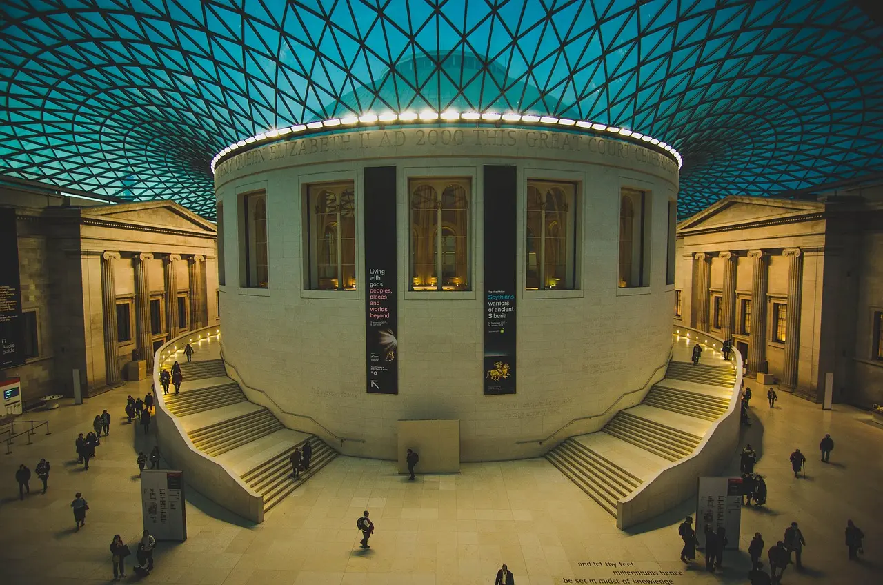 Visitors admiring ancient artifacts in the British Museum's Egyptian gallery