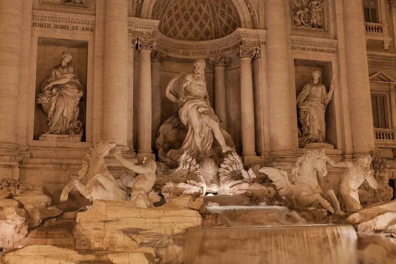 Early morning view of Trevi Fountain with no crowds, soft sunlight reflecting on water